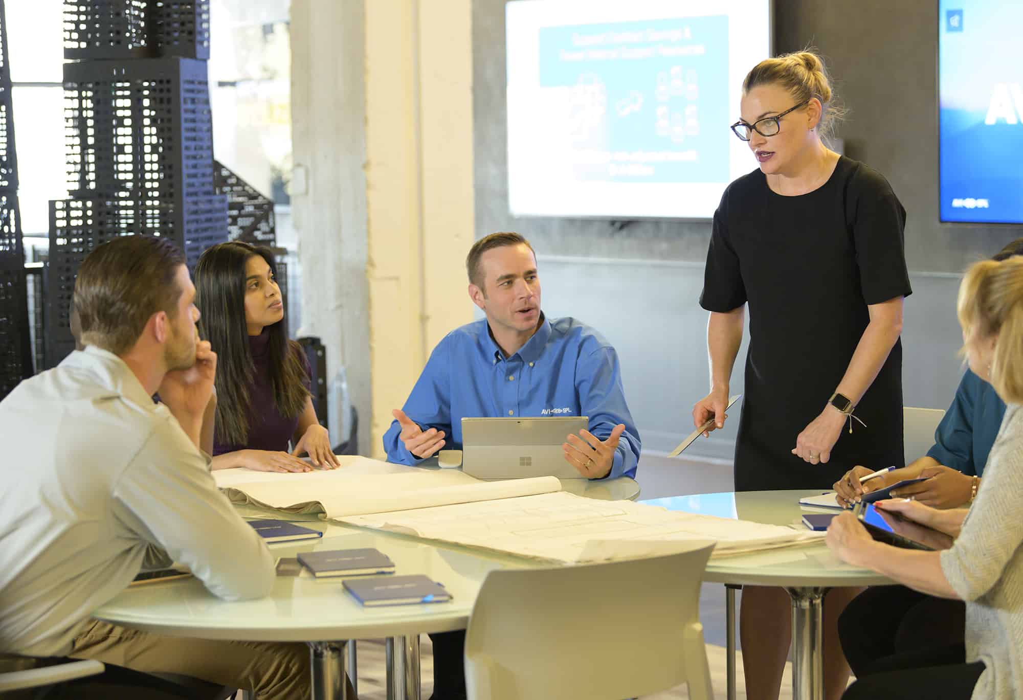 staff working with consultants and architect