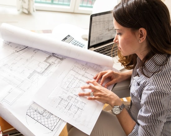 female architect working on plans